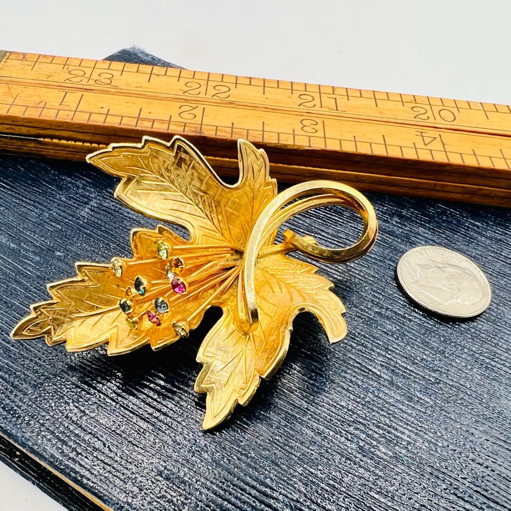 Vintage gold tone maple leaf brooch pin with colorful rhinestone head pins